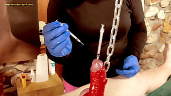 Mistress April - needles and syringe in cock head of her slave